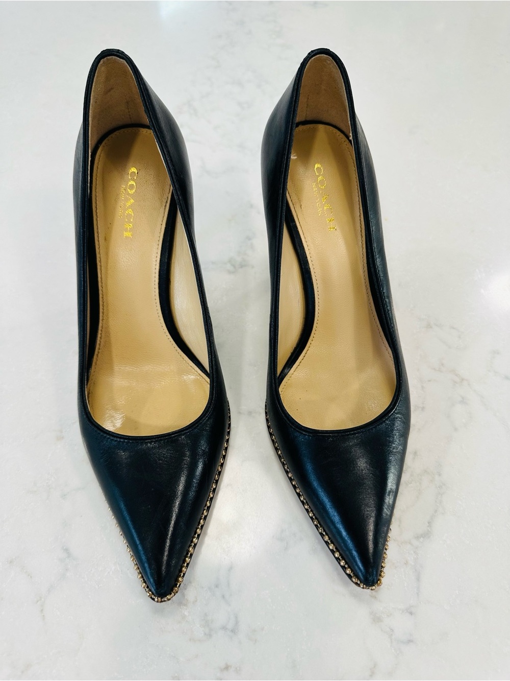Coach Tamera Black Leather Pointed Toe Pumps with Gold Beaded Accent